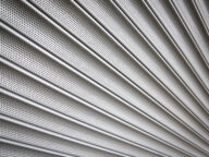 Metal,Security,Shutters,Protecting,A,Small,Shop,When,Closed
